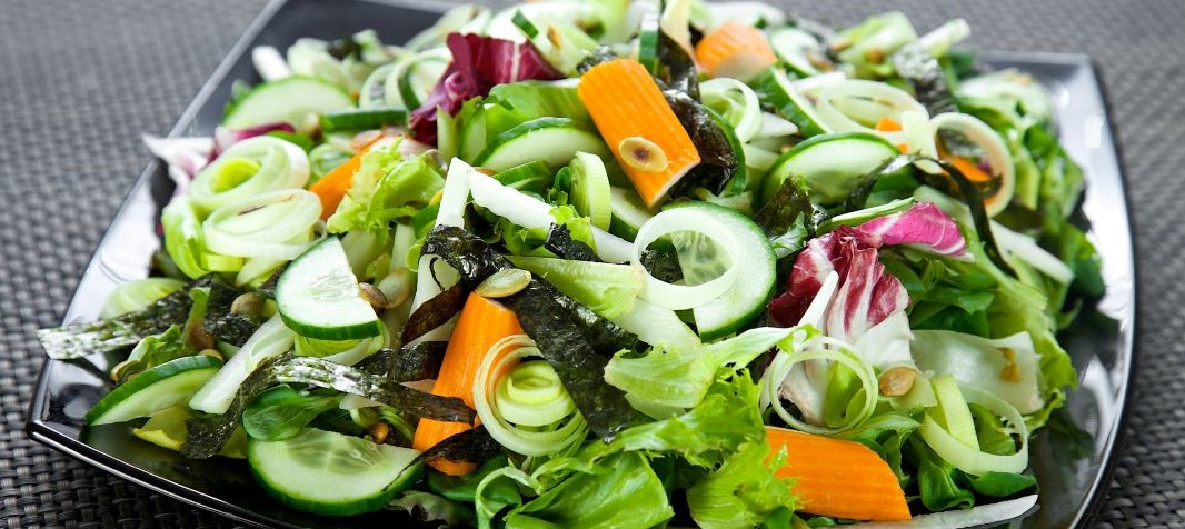 Salad with surimi, nori, cucumber and pumpkin seeds